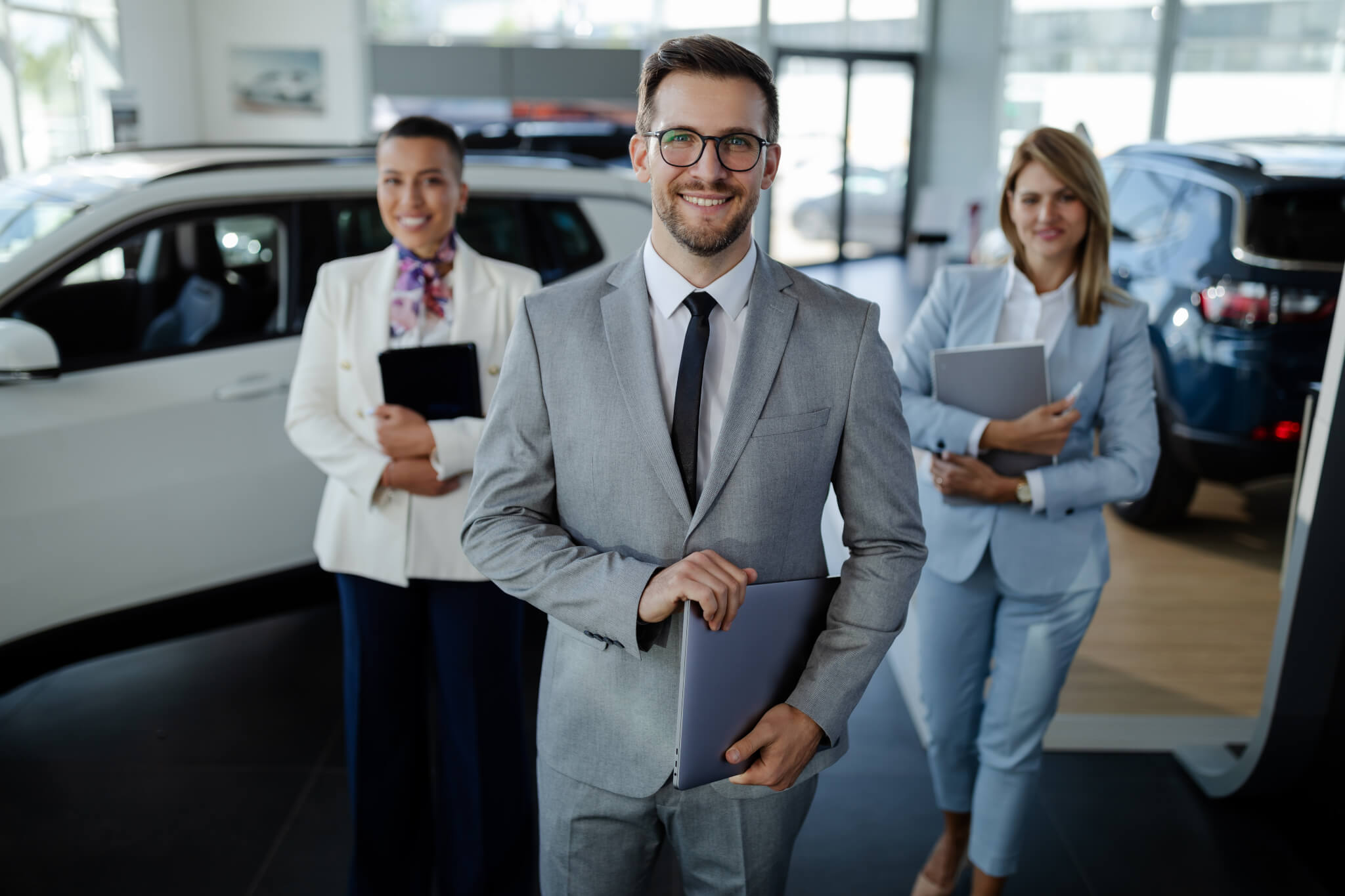 salesteam-in-dealership-three-beautiful-consultants-or-managers-in-elegant-suit-looking-on-camera-.jpg salesteam-in-dealership-three-beautiful-consultants-or-managers-in-elegant-suit-looking-on-camera-.jpg